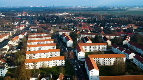 row of residential houses with traffic in the street of city in germany