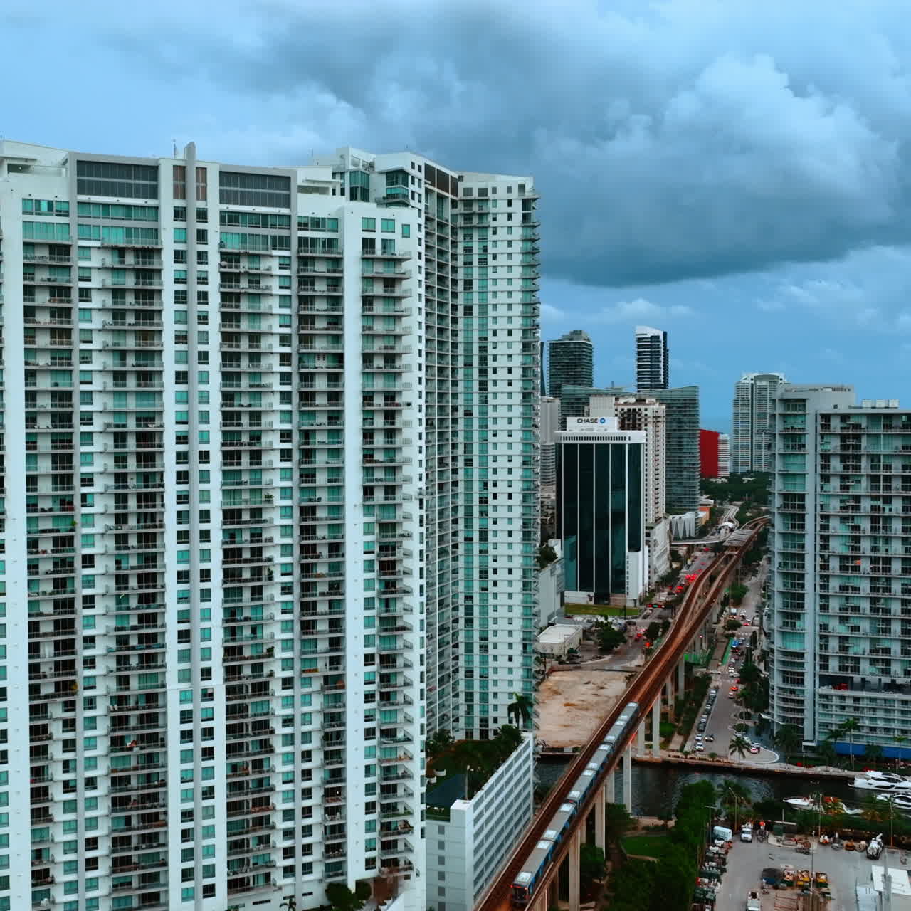 High-rise blocks of flats in the area of Miami, Florida, USA. Heavy clouds above the buildings.