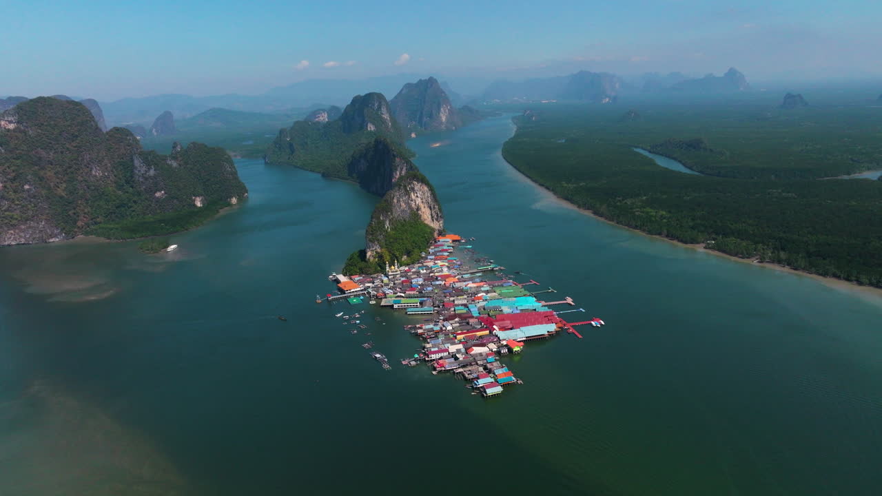 Limestone Formations And Floating Village In Koh Panyee In Phang Nga Bay, Thailand. Aerial Drone Shot