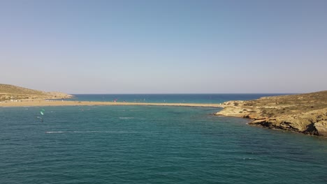 kitesurfer on the famous island rhodes in greece, aerial sideways on sunny day