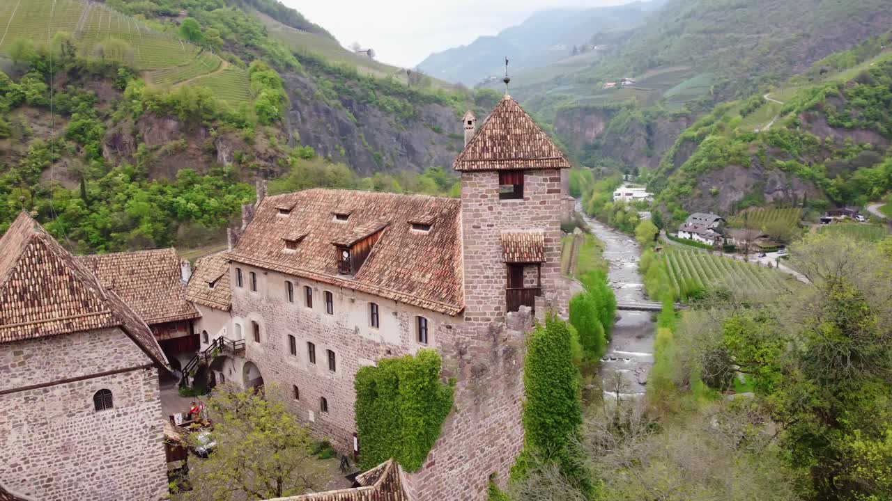 Aerial footage of Roncolo Castle, showcasing scenic views and medieval walls.