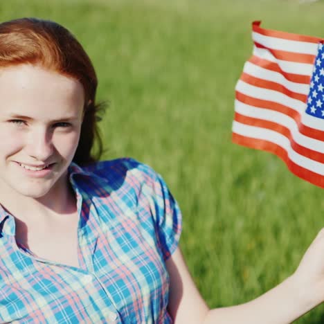 attractive red-haired teenage girl with the american flag