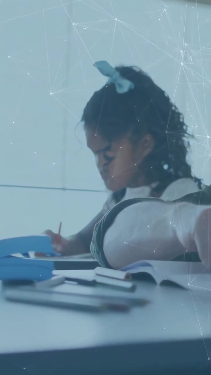 Vertical video: Girl starting classwork at desk writing with pencil as moving bar showing progress