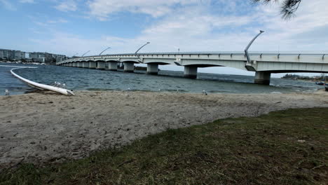 slo-mo paradise point beach bridge on a windy day