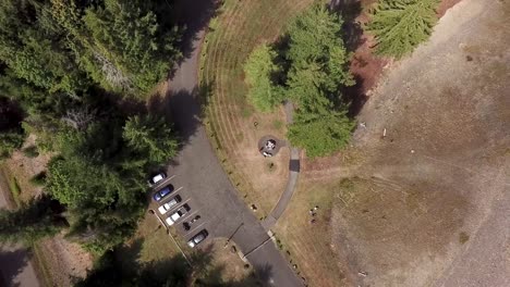 Vehicles-Parked-Under-Sunlight-Near-Dam-Site-In-Wynoochee-Lake,-Montesano,-Washington