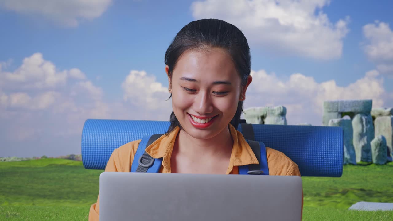 Woman Working on Laptop While Traveling at Stonehenge