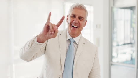 senior businessman, rock hand sign
