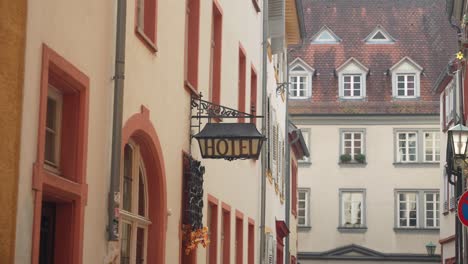 old vintage hanging hotel sign in historic city heidelberg, germany