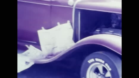 vintage purple car parked in garage showcasing 1970s auto style. circa usa - 1970s: an authentic 1970s purple car takes center stage as it sits parked inside a garage.