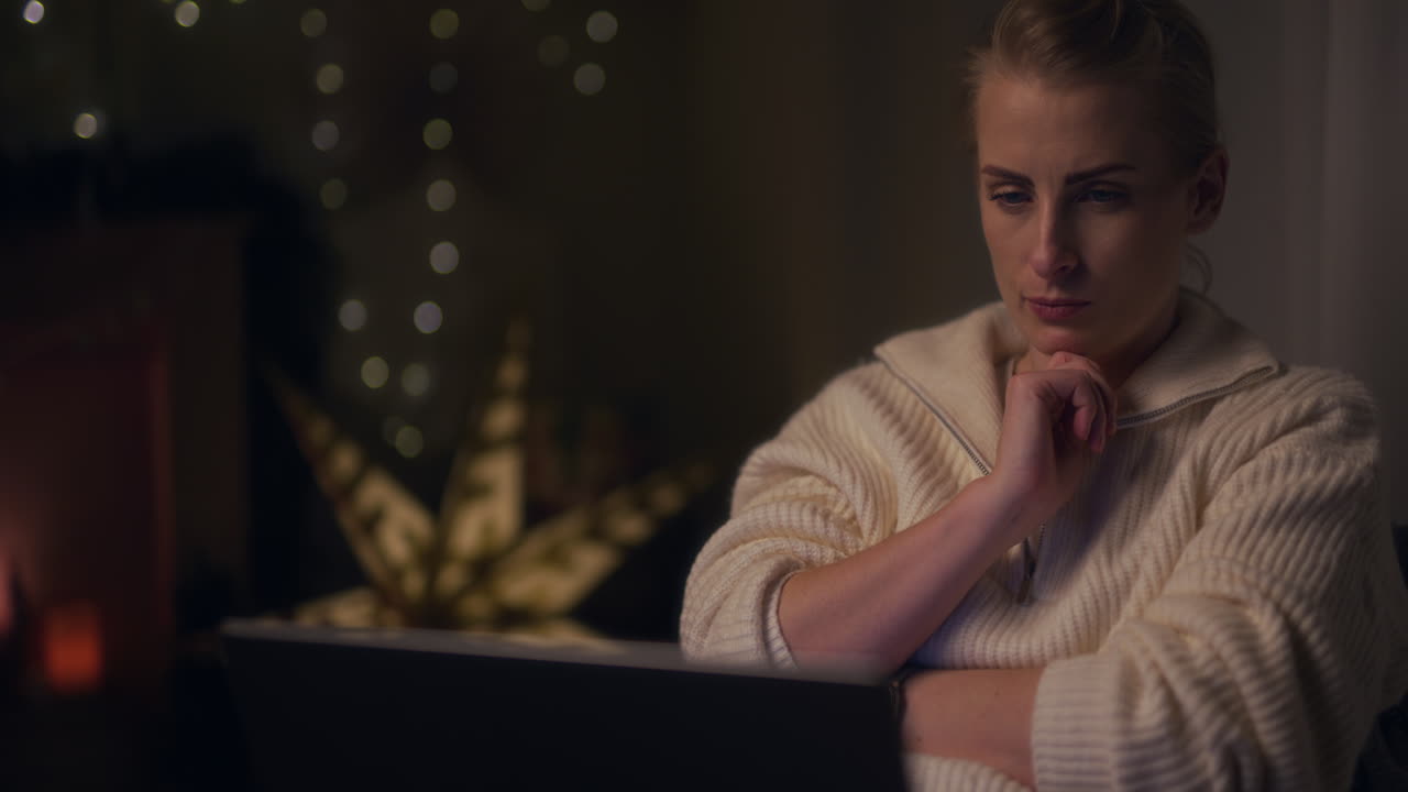 Sad Stressed Woman Sitting on Armchair at Night and Worries and Sad