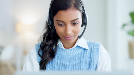 Portrait-of-a-call-center-agent-using-a-headset