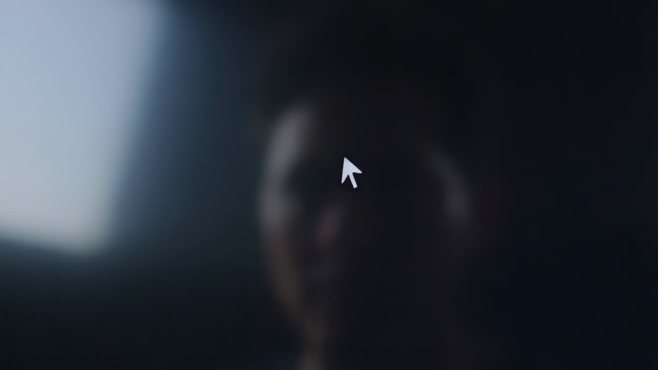 Blurry image of a person with a digital mouse cursor