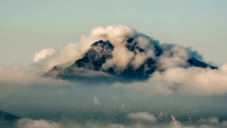 mountain peak with foggy clouds time lapse