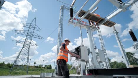 electrical engineers inspect the electrical systems at the equipment control cabinet