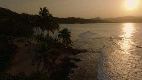 La-Playita-beach-at-sunset,-Las-Galeras-in-Samana-peninsula,-Dominican-Republic