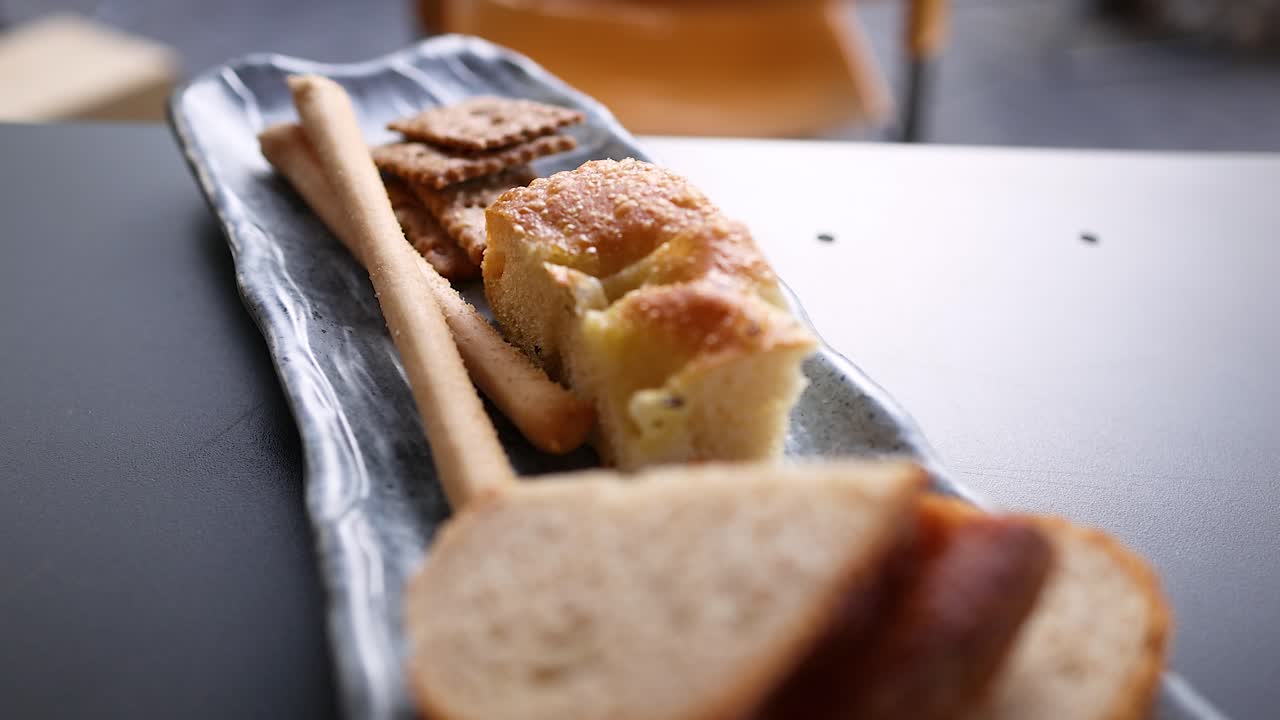 Various breads and crackers on a serving plate