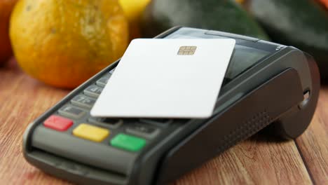 payment terminal with credit card for grocery shopping