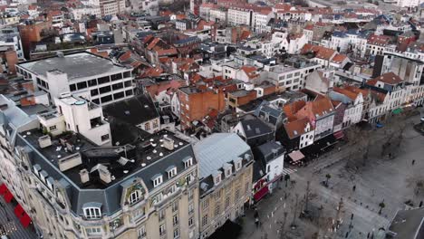 Aerial-close-flight-over-traditional-Brussels'-buildings-on-cloudy-day,Belgium