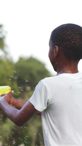 group of kids playing with water gun