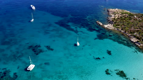 top down aerial drone view of cala sabina, aranci gulf, emerald coast, sardinia, italy