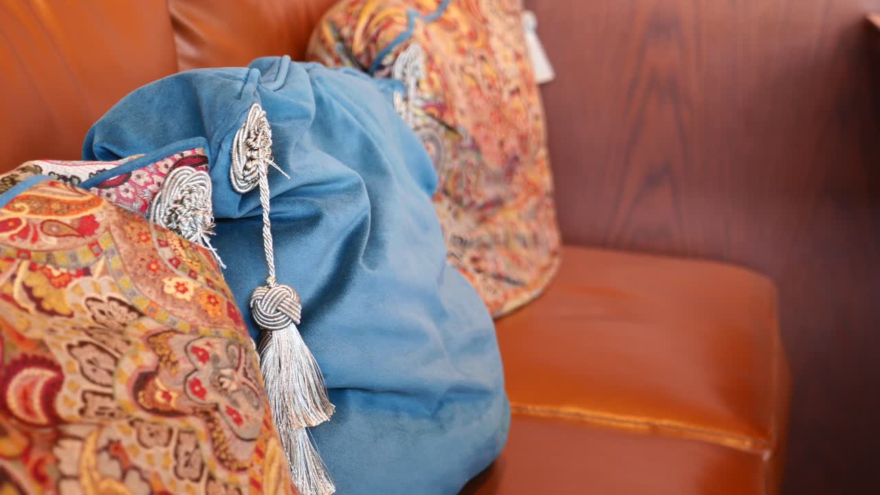 Decorative Pillows on a Brown Leather Sofa