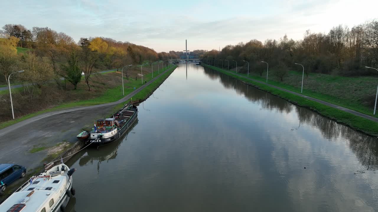 Aerial zoom in view of canal and surrounding architecture in Brussels, Belgium, captured on a sunny clear day