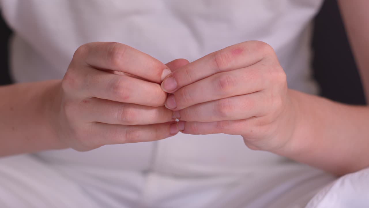 Tensed Hands Of Nervous Woman With Anxiety And Stress Disorder. closeup shot