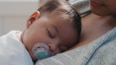 baby-sleeping-peacefully-in-mothers-arms-loving-mother-holding-infant-caring-for-sleepy-toddler-at-home-4k