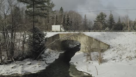 Cars-pass-over-bridge-of-tributary-of-Piscataquis-river