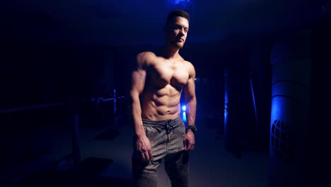 healthy athlete at gym. young bodybuilder preparing for fitness training at gym
