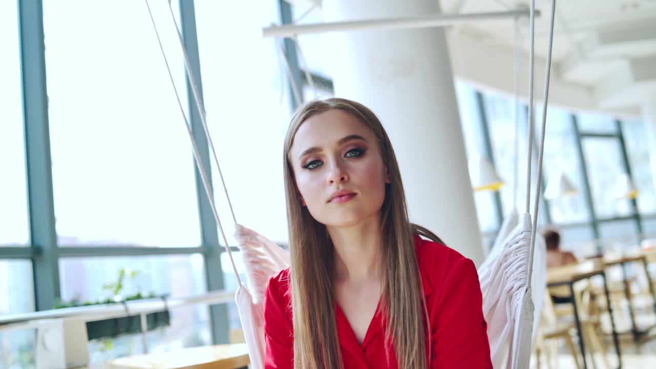 Happy beautiful woman in cafe. Fashion portrait of style woman resting in cafe