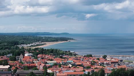 long coastline along swedish port city simrishamn, rain clouds approaching