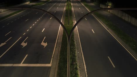 a dynamic nighttime timelapse captures the vibrant streaks of car lights weaving through a dual carriageway, illustrating urban motion and connectivity