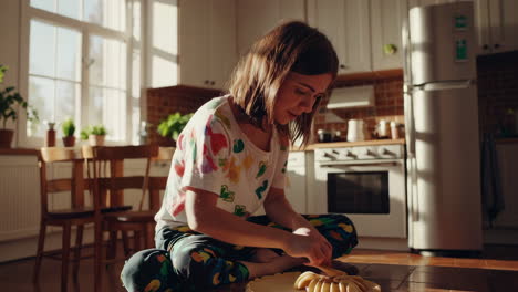 woman making pie in kitchen