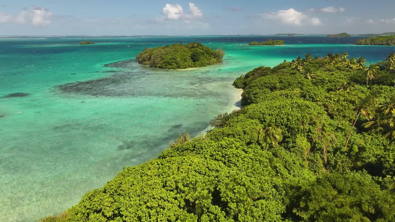 Vava'u, Tonga - An Enchanting Sight of an Island Embraced by Clear Turquoise Waters and Thriving, Tropical Greenery - Drone Flying Forward