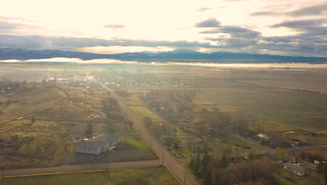 aerial drone footage of alturas, a small town in northern california, during a beautiful and hazy morning