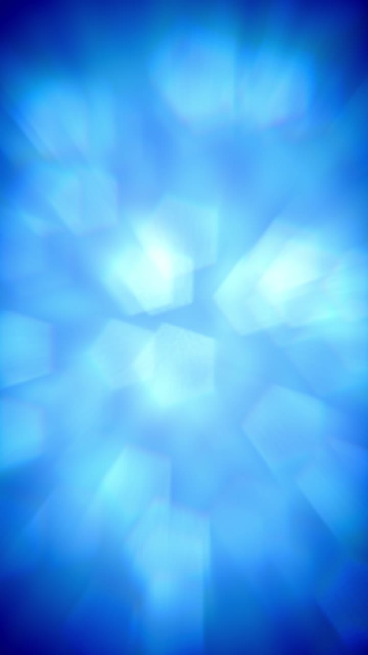 Uno sfondo morbido e pulito di forme bokeh blu in delicato movimento crea un'animazione verticale calma e aziendale, con loop continuo.
