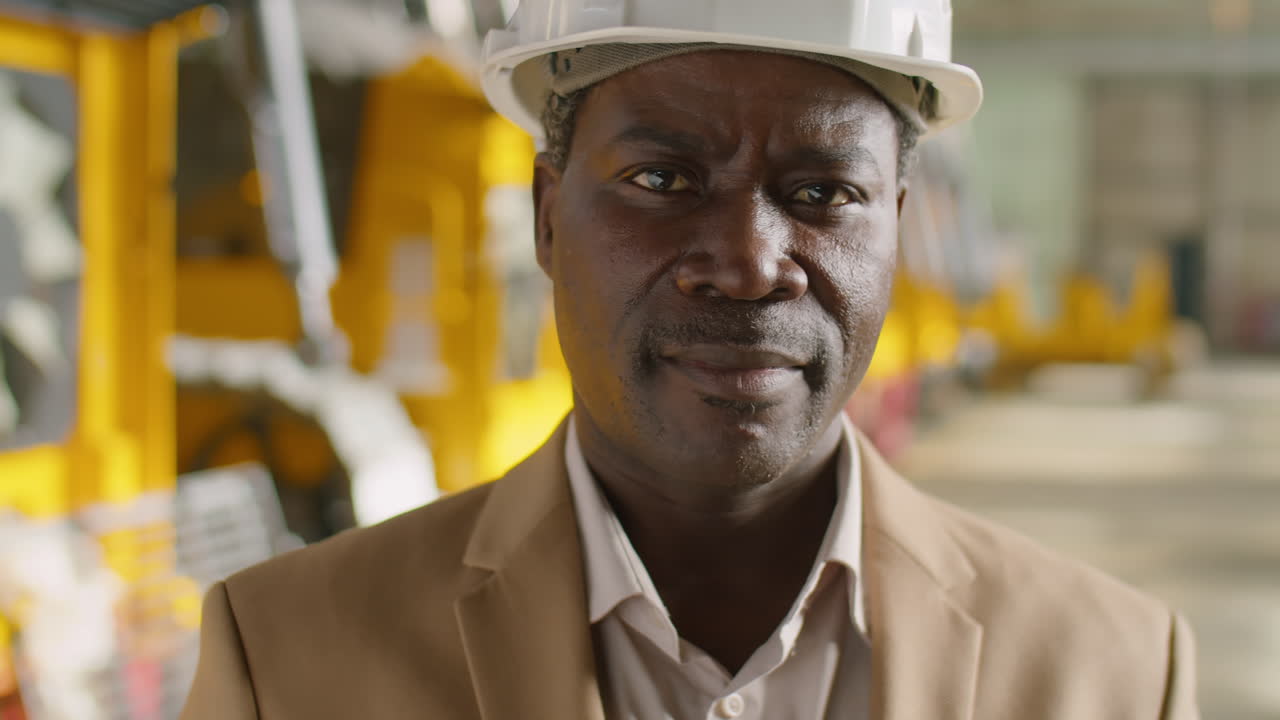 Portrait of African American Engineer at Work in Factory