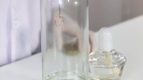 copper wire oxidizes in acetone-filled bottle