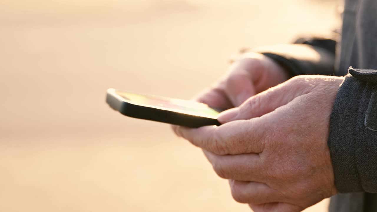 Closeup of female hands using mobile phone