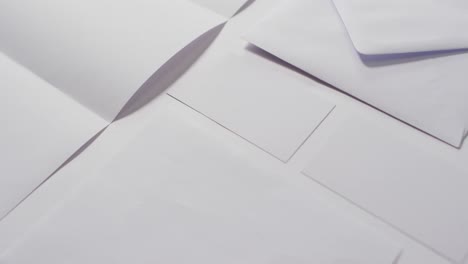 Video-of-envelope-and-white-cards-with-copy-space-on-white-background