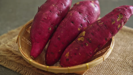 fresh japanese sweet potatoes on basket