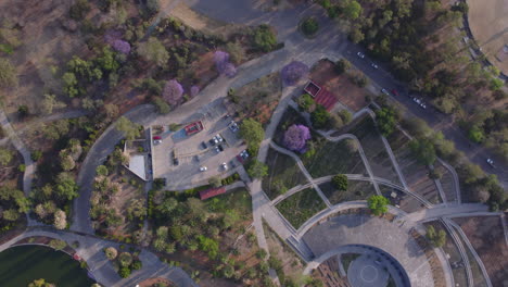 Aerial-fly-over-view-Chapultepec-district-big-green-modern-park-area-with-artwork-and-pathways