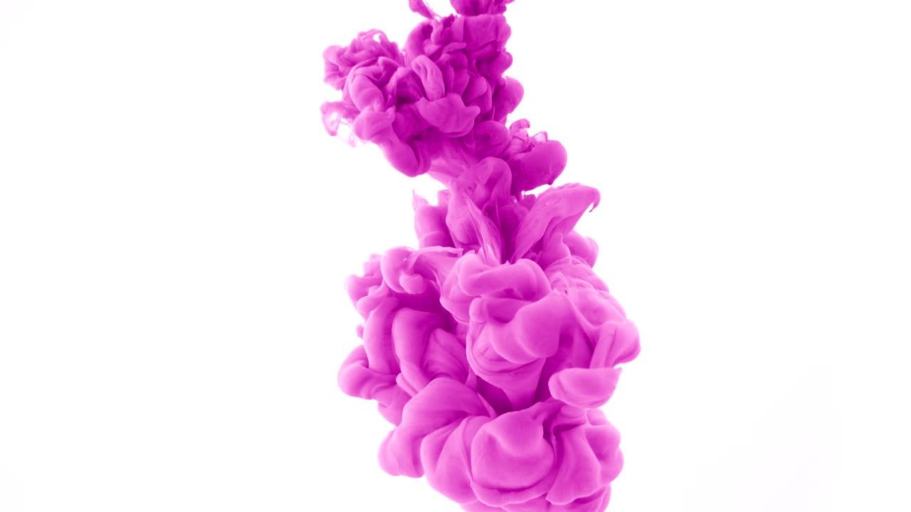 Pink ink dropped in water on white background