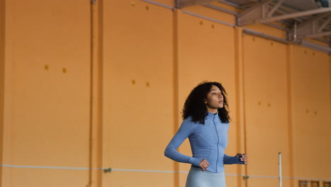 Woman-stretching-indoors