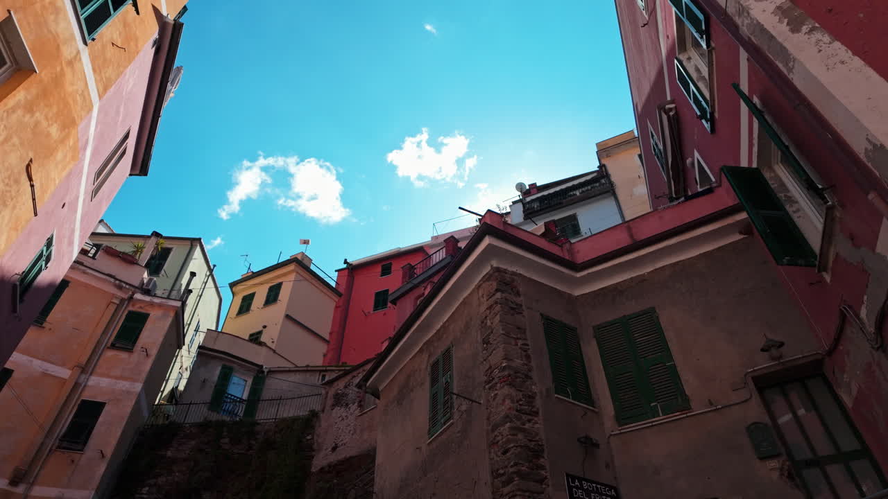 Vibrant view of narrow street in Vernazza, Cinque Terre with colorful buildings