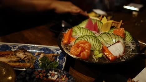 sashimi platter being served at a restaurant