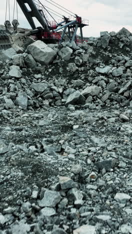 giant excavator loading a dump truck at a mining site