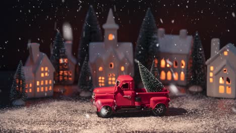Animated-Christmas-decoration,-snow-is-falling-over-scenery-with-Santa-Claus,-pine-trees,-houses-and-deer-animals