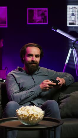 vertical video upbeat player engaging in fun videogames, enjoying leisure time